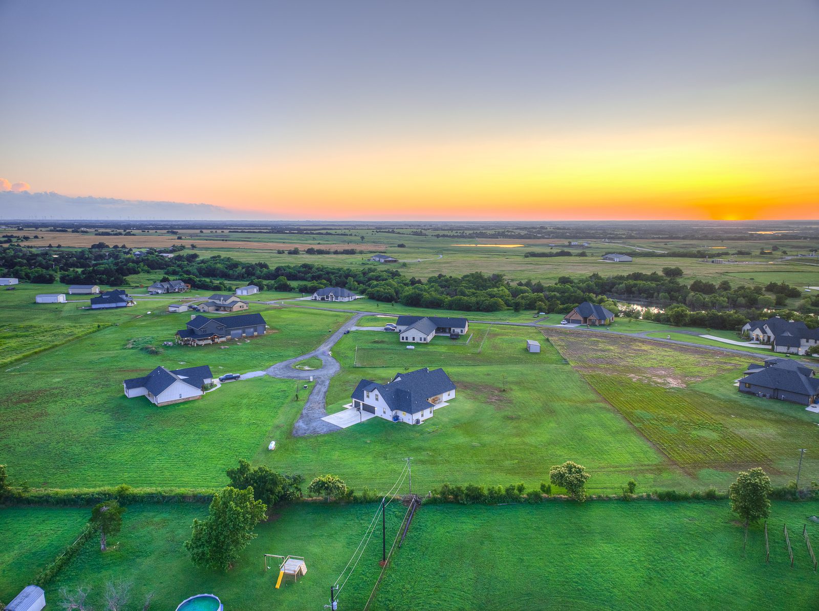 Aerial view of acreage at sunset